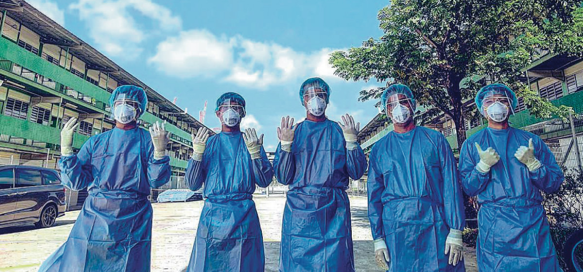 Group of people with PPE suit